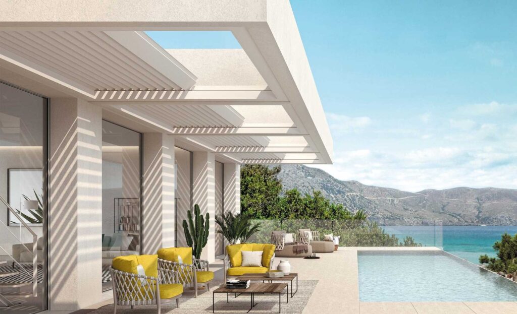 Terrassenüberdachung mit teilweise geöffnetem Lamellendach und Meerblick